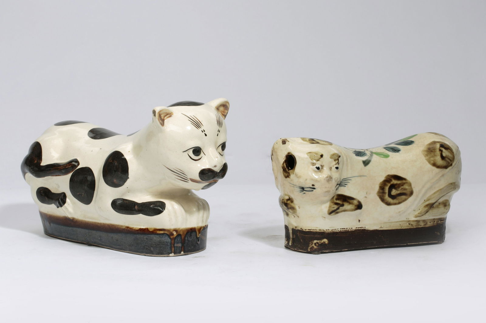 Two Chinese Dingware style porcelain cat pillows (1 of 2)