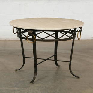 A steel table, manner of Gilbert Poillerat: A patinated steel circular occasional table In the manner of Gilbert Poillerat post 1950 Surmounted by a marble top. height 26in (66cm); diameter 36in (91.5cm)