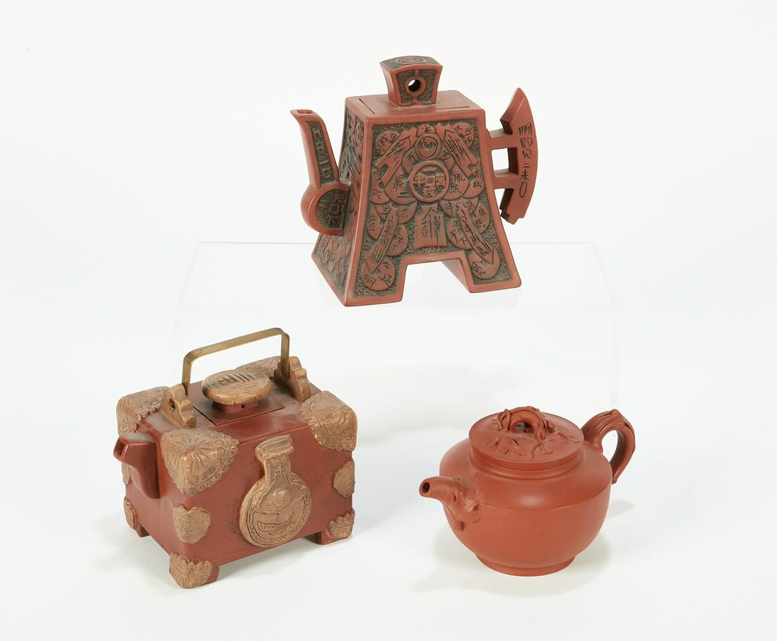 A group of three Chinese yixing pottery teapots (1 of 5)