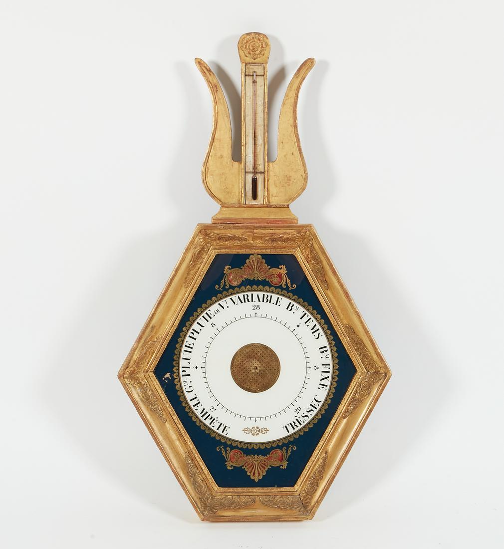 A Louis XVI eglomise and carved giltwood barometer (1 of 2)