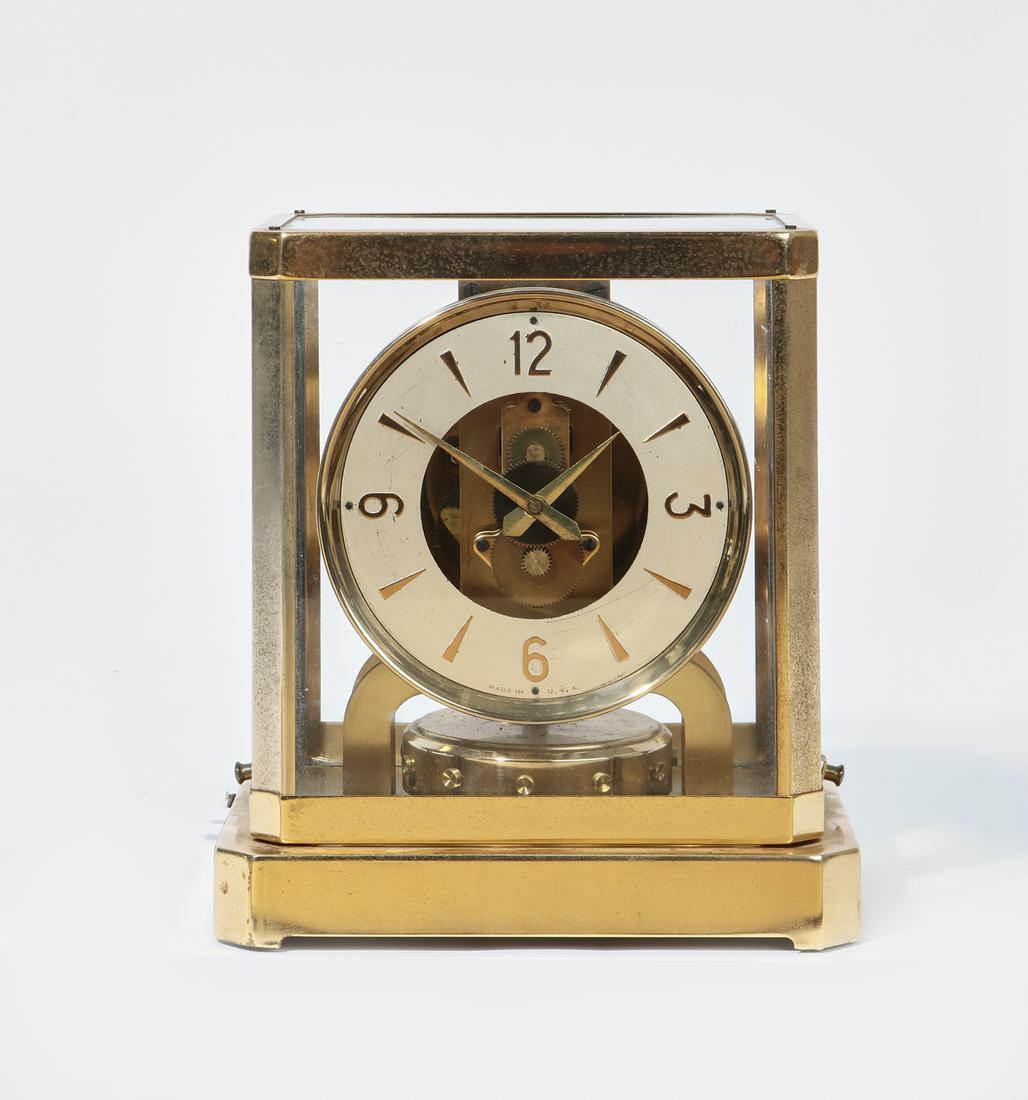 A modern brass electric mantel clock: A modern brass electric mantel clockheight 9in (23cm); width 8 1/4in (21cm); depth 6 1/2in (16.5cm)