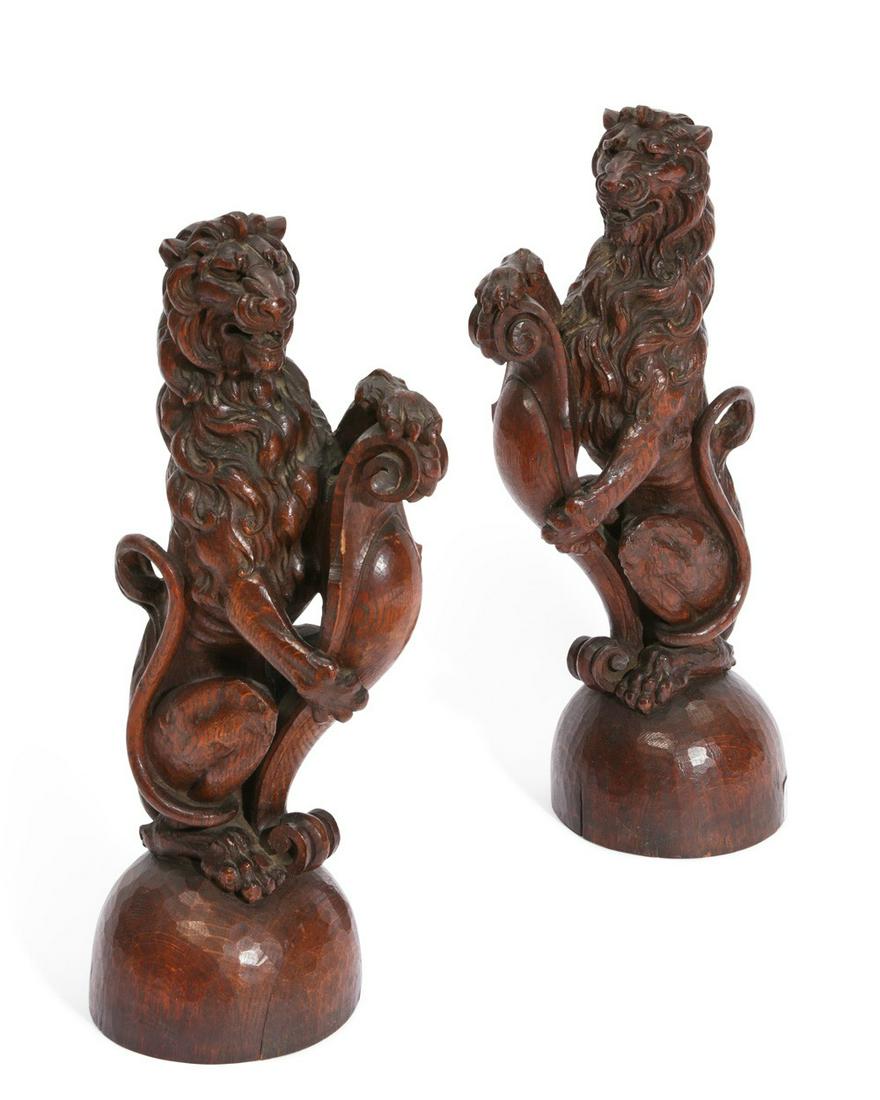 Pair of Continental models of lions sejant (1 of 3)