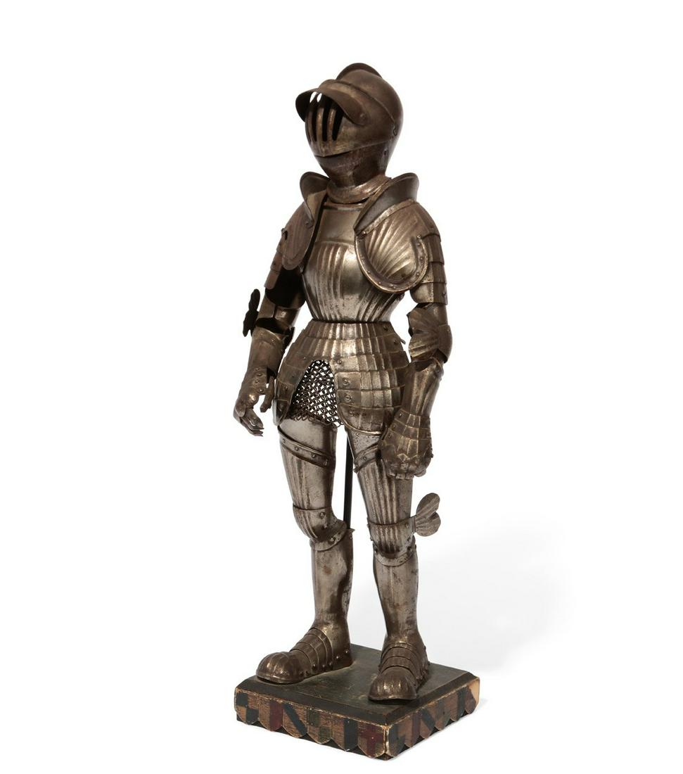 A miniature articulated suit of steel plate armor (1 of 3)