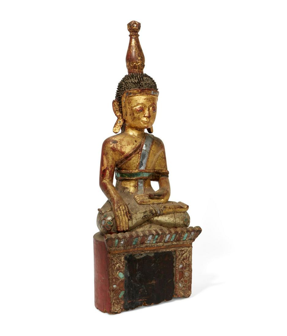 A Thai painted model of a seated Buddha: A Thai glass inset red painted and gilt model of a seated Buddha height 31 1/2in (80cm); width 12in (30.5cm); depth 9in (23cm)