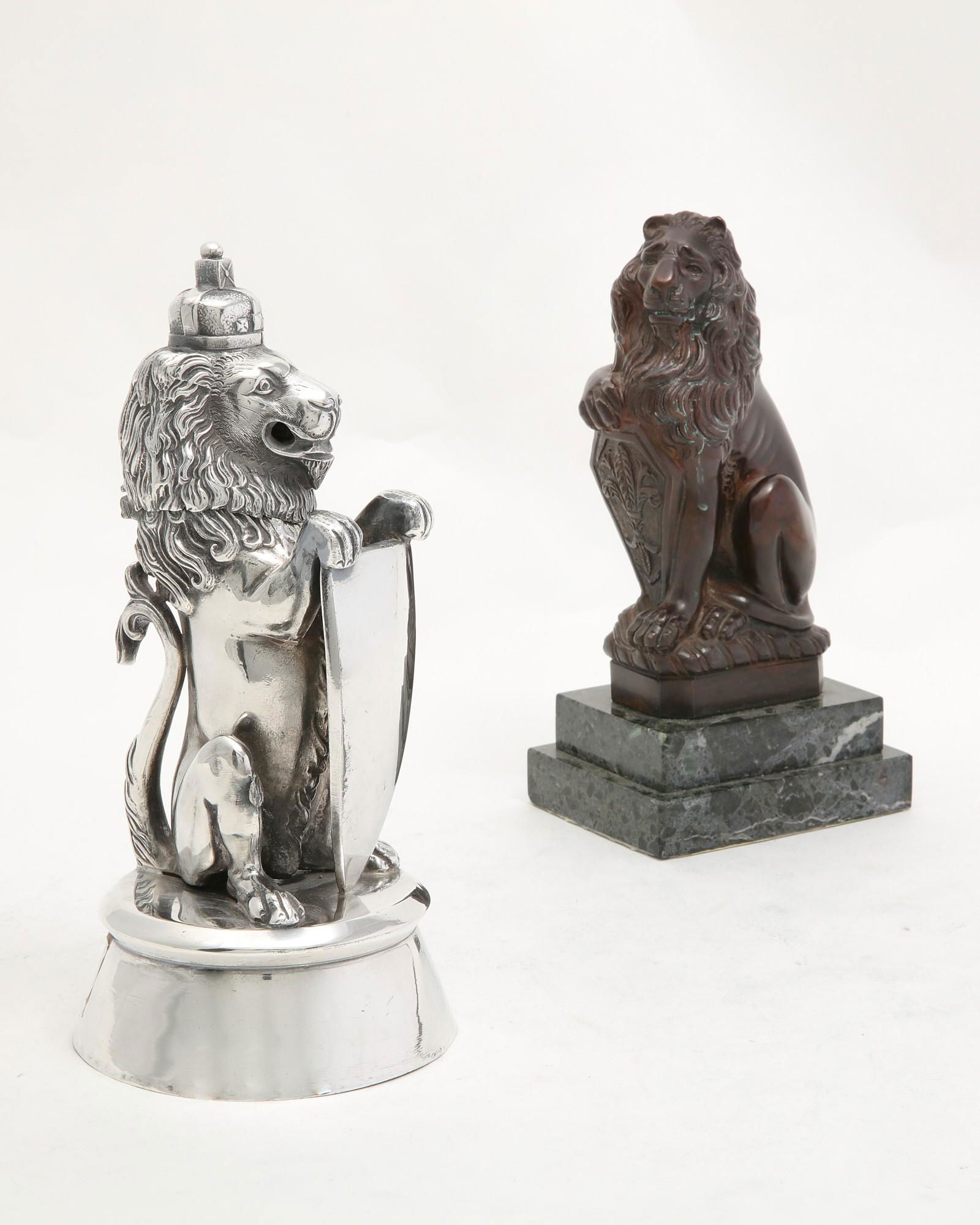 A silvered metal lion form inkwell and another (1 of 2)