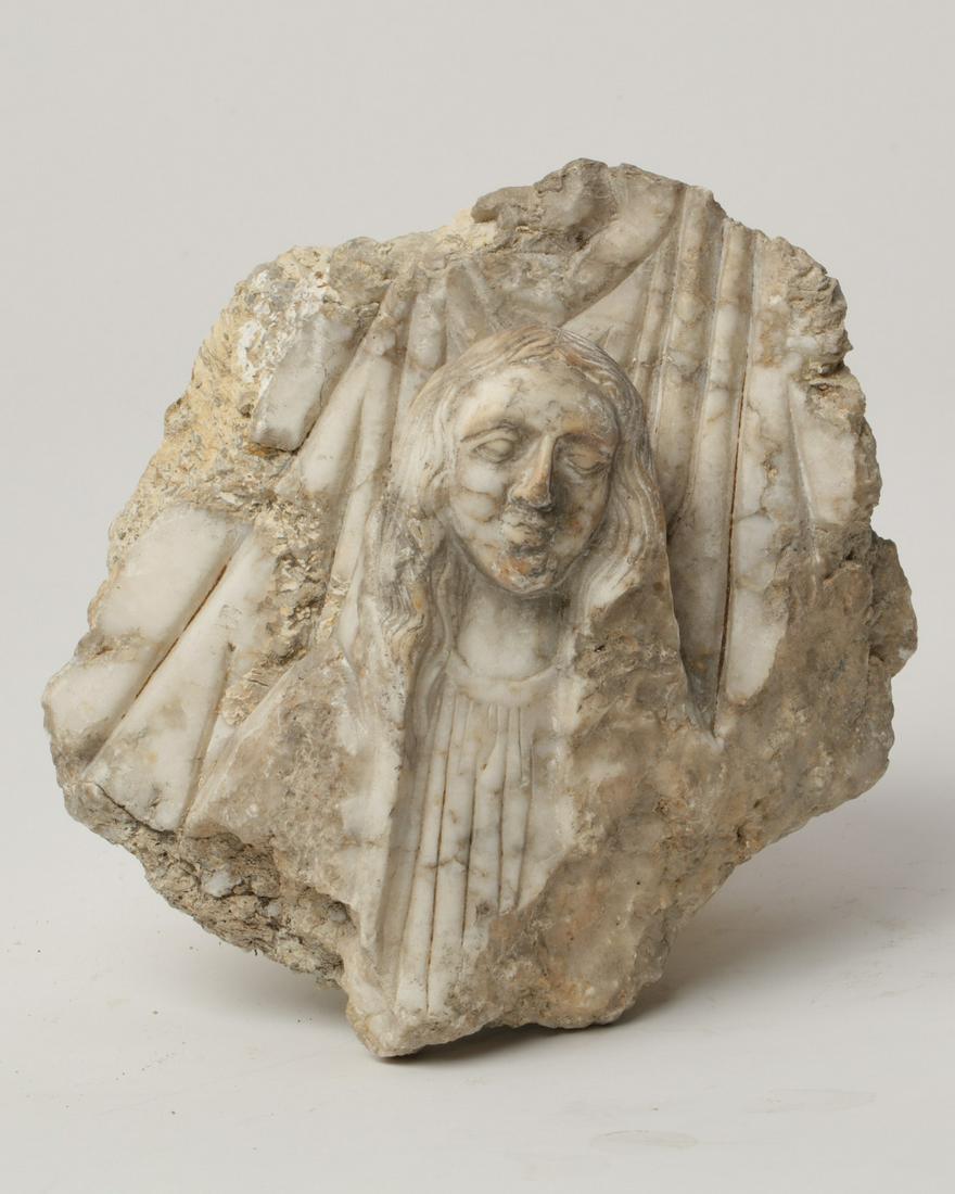 A marble and cast stone figural relief fragment (1 of 2)