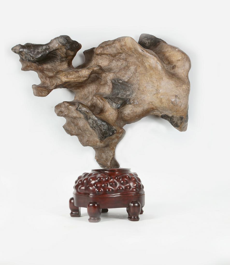 A large Chinese scholars rock on hardwood stand (1 of 3)
