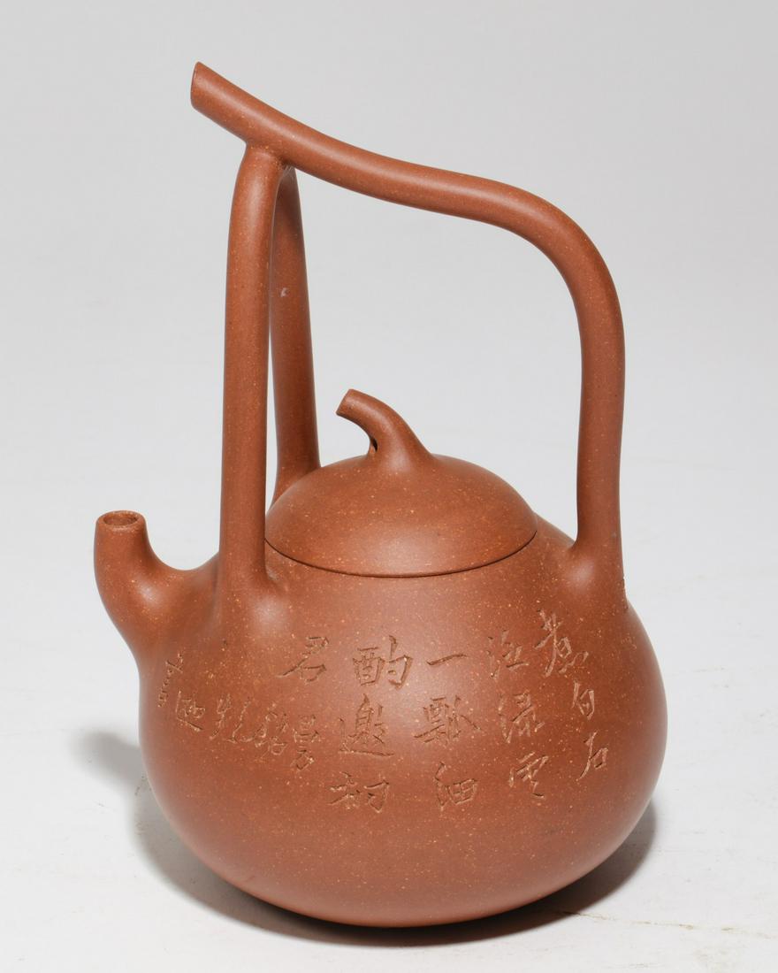 A Chinese Yixing pottery teapot (1 of 3)