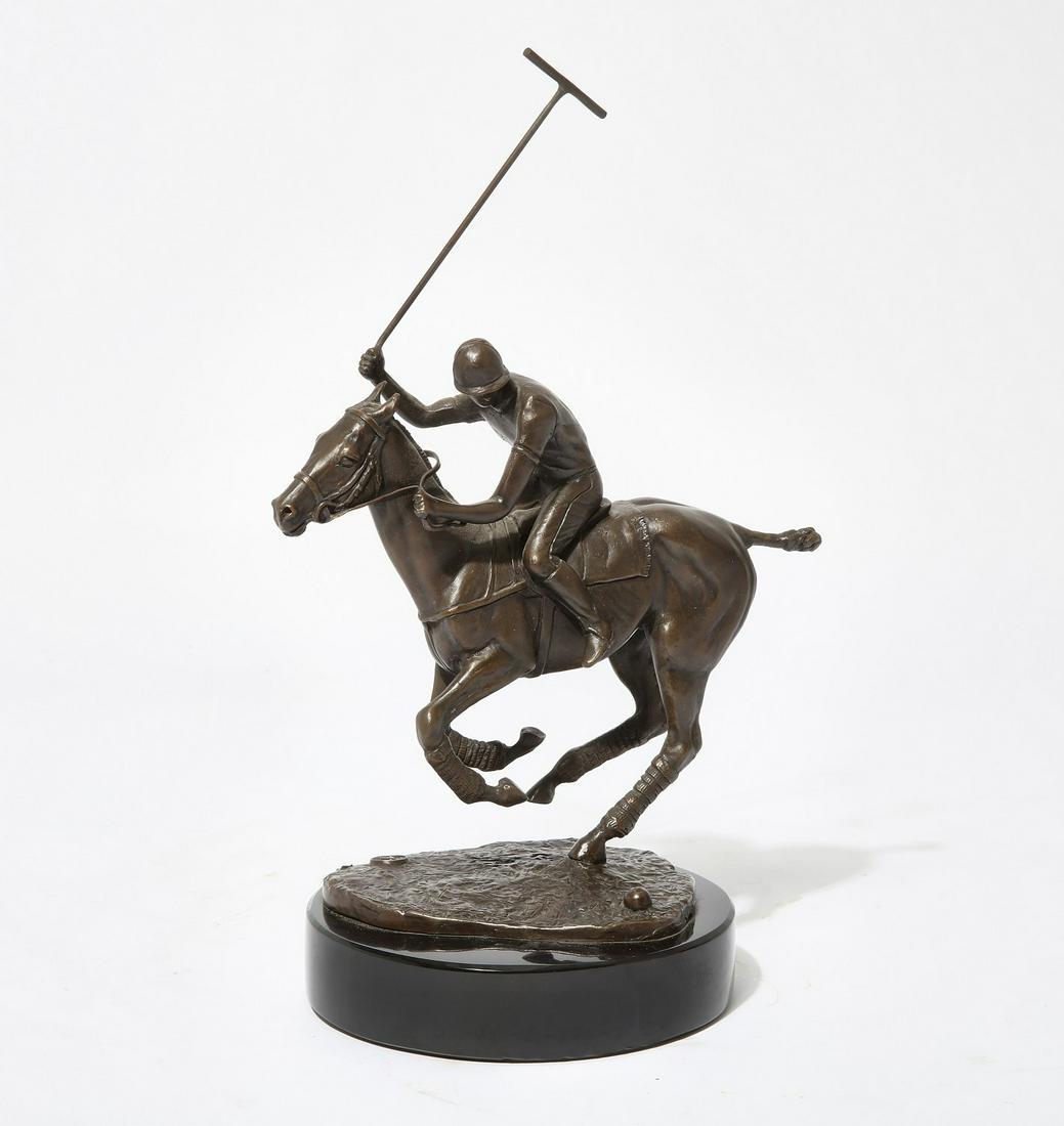 An American bronze model of a polo player: An American patinated bronze model of a polo player on horsebackmodernImpressed with ART BRONZE foundry pastille, on a circular black slate base.height 11in (28cm); width 8in (20cm); depth 4in (10cm);