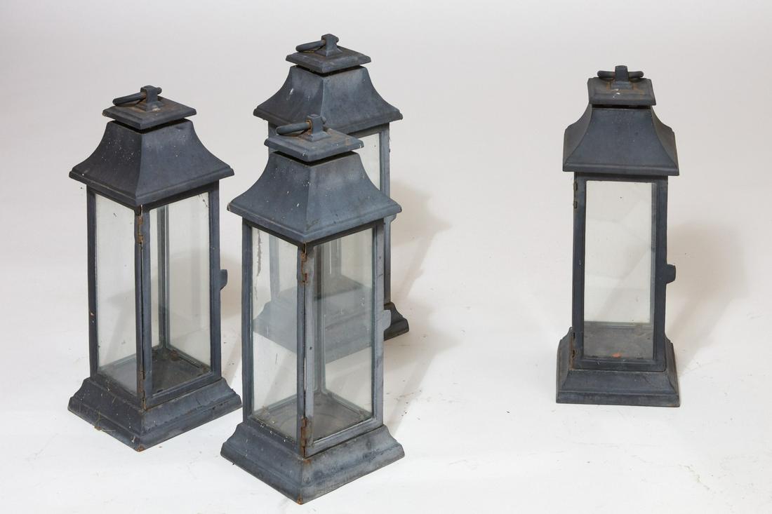 Set of four large ebonized metal hanging lanterns: A set of four large ebonized metal hanging lanternsmodernheight 23 1/2in (60cm); width 8 1/2in (21.5cm) square Provenance:Property from a Private Collection, Beverly Hills, California.