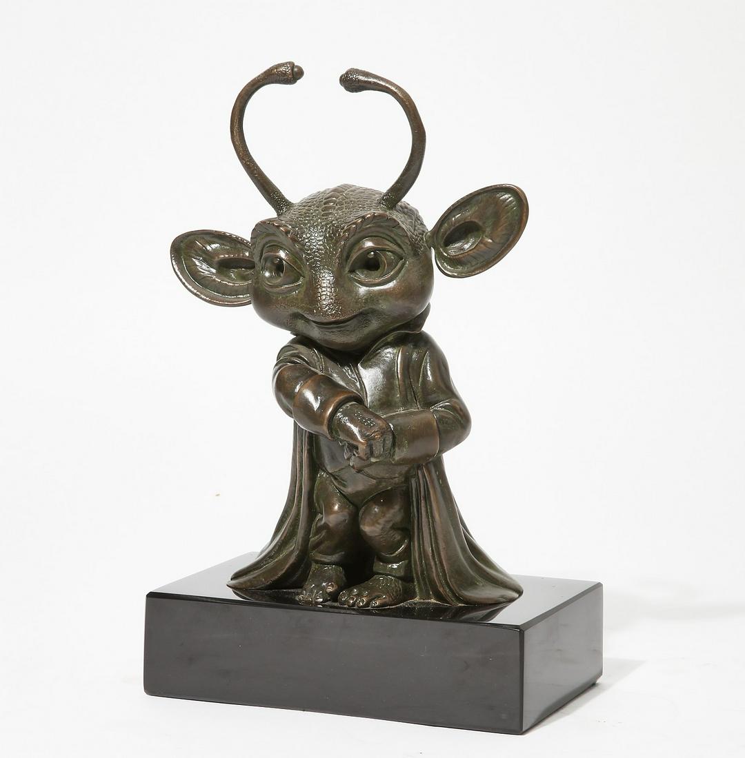 A patinated bronze figure of an alien (1 of 4)
