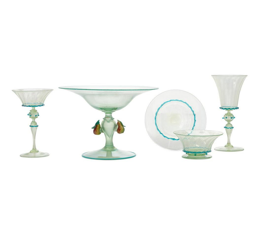 A suite of Venetian green and blue glassware: A suite of Venetian green and blue glassware 20th century Comprising seventeen 7in champagne coupes; nine 8 1/4in wine glasses; ten footed sherbet dishes, diameter 5 1/4in and fourteen under plates, d