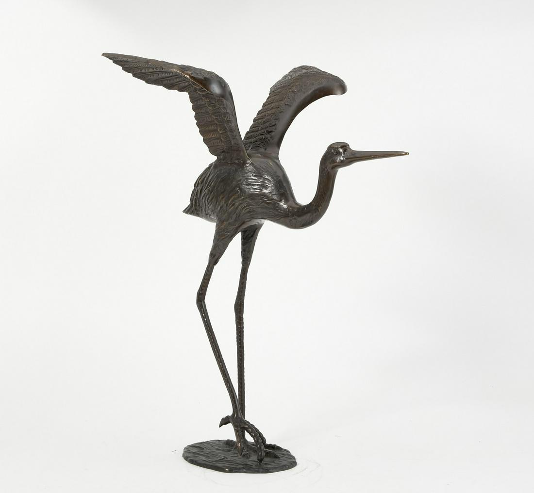A patinated bronze model of a crane (1 of 3)