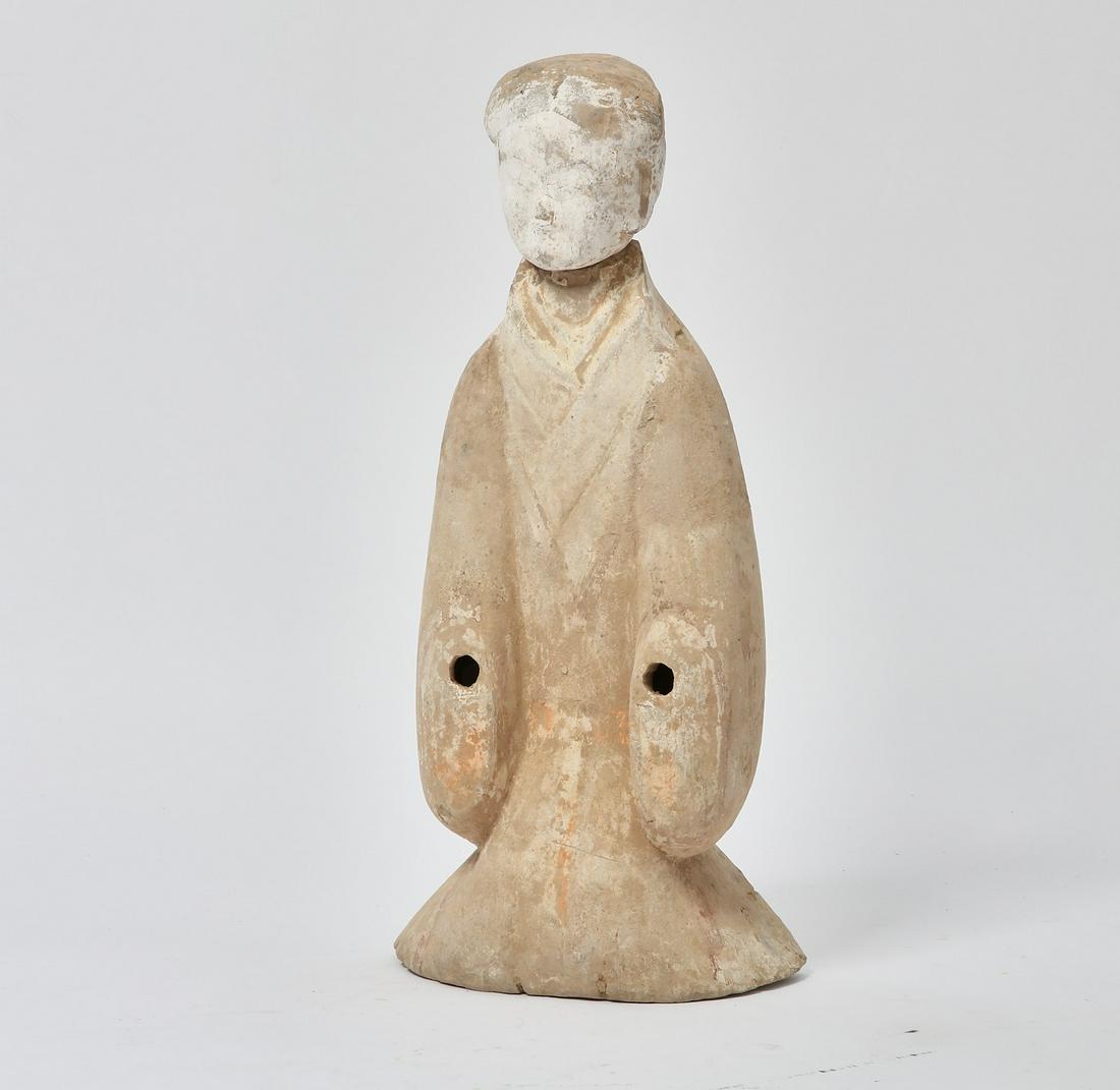 A Chinese pottery figure of an attendant (1 of 3)