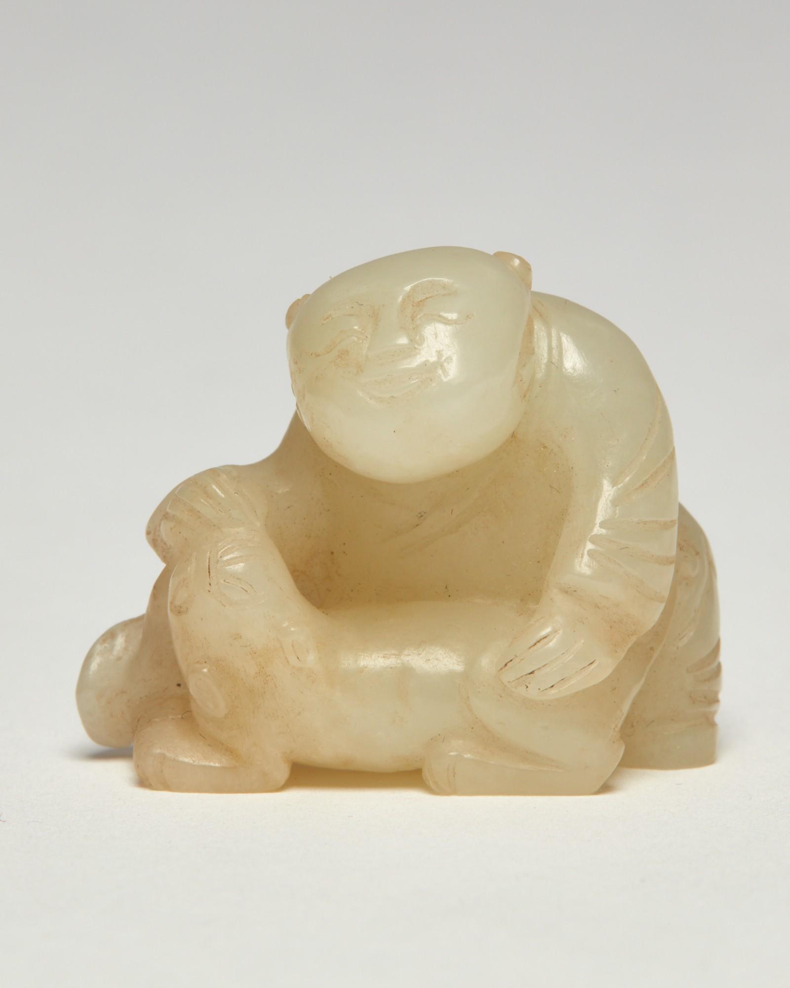 A Chinese carved hardstone figure with an animal (1 of 7)