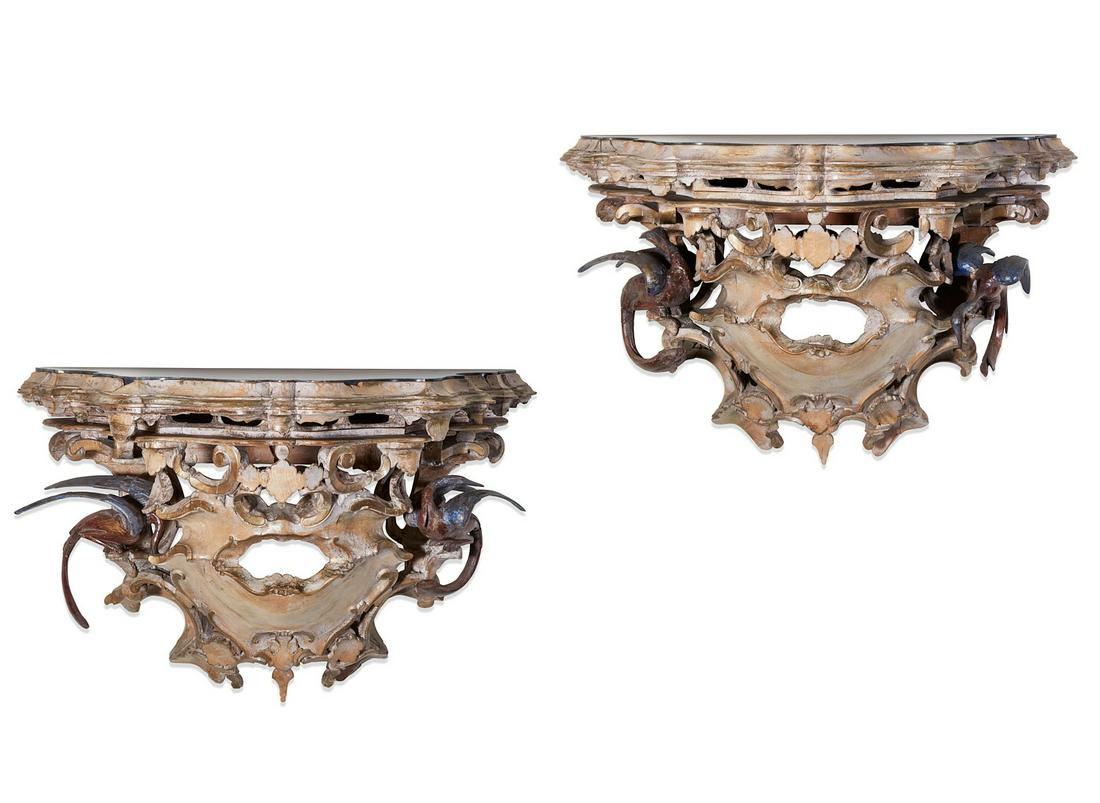 Pair Italian Baroque style painted wall brackets: A pair of whimsical Italian Baroque style polychrome decorated wall brackets 19th century With inset slate tops. height 21in (53cm); width 32in (81cm); depth 18in (46cm)
