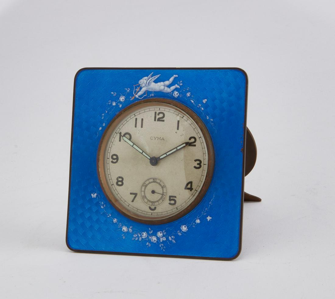 A Gubelin blue enameled metal travel alarm clock (1 of 2)