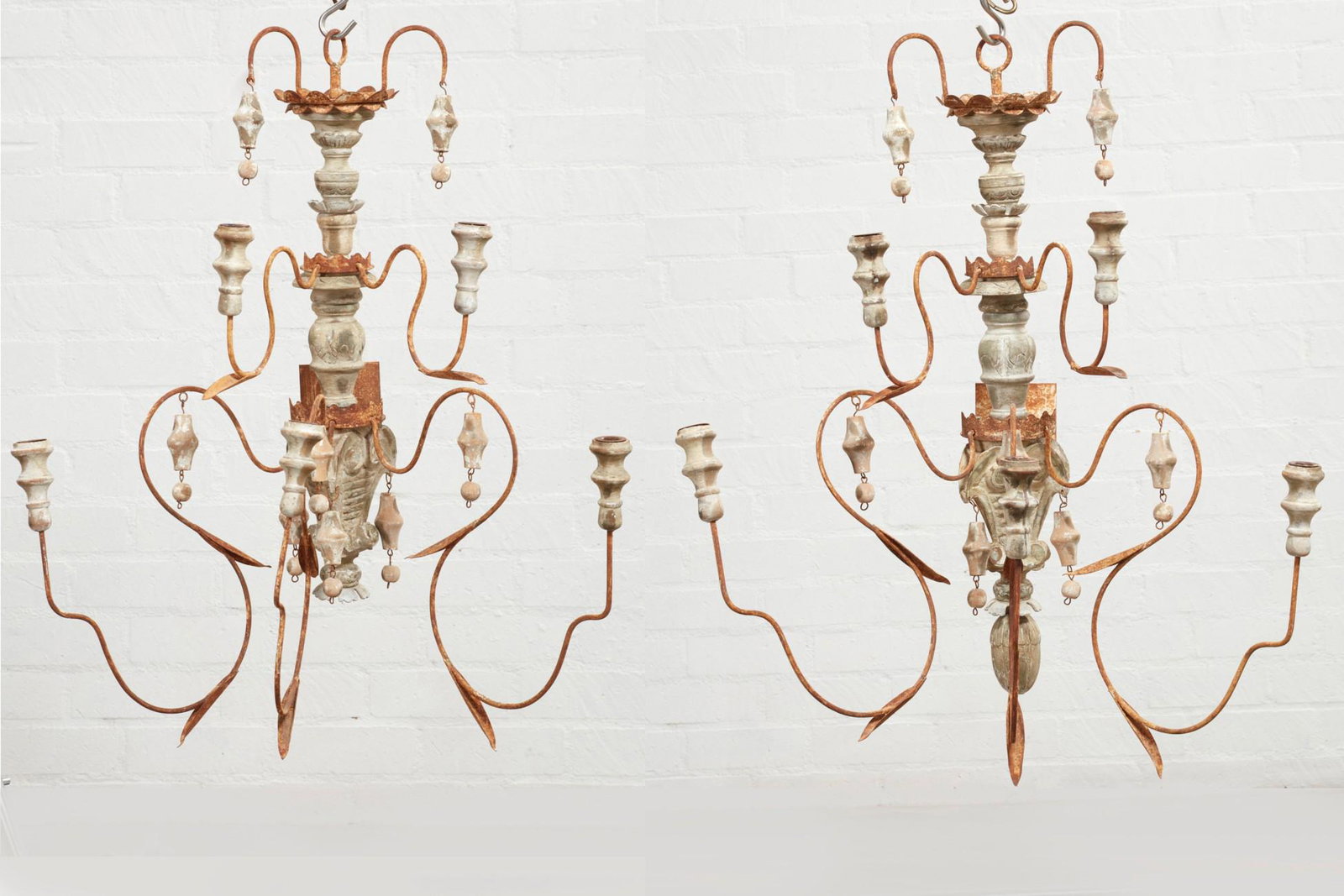 A pair of Italian Baroque style wall lights: A pair of Italian Baroque style white painted five branch wall lights 19th/20th century height 35in (89cm); width 30in (76cm); depth 24in (61cm)