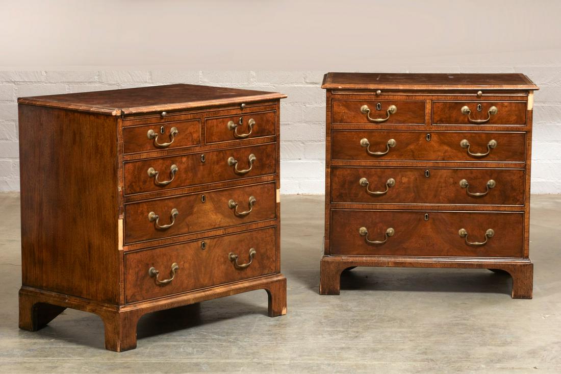 Pair of Burton-Ching Ltd. George II style chests: A pair of Burton-Ching Ltd. George II style crossbanded walnut chests post 1950 Each fitted with a brushing slide above two short and three long drawers. height 32in (81cm); width 32in (81cm); depth 2