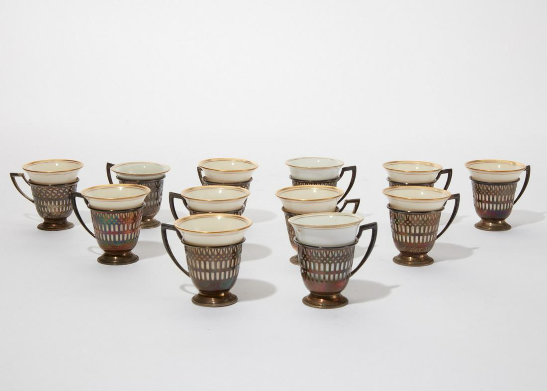 Twelve Lenox porcelain and silver demitasse cups: A set of twelve Lenox porcelain and sterling silver demitasse cups height 2 1/4in (5.5cm); diameter 2 1/4in (5.5cm); total silver weight approximately 6oz troy Provenance: Property from a Private Palo
