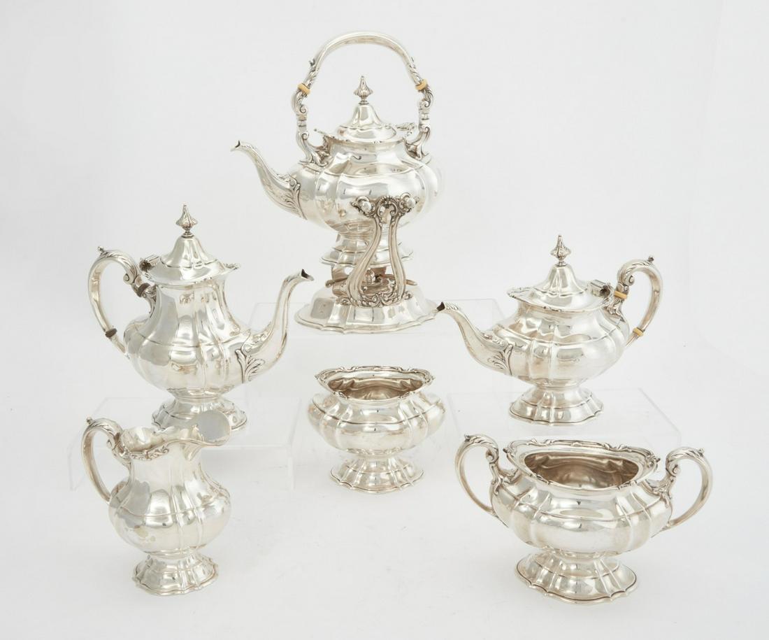 A Reed & Barton sterling silver six part tea set: A Reed & Barton sterling silver six part tea and coffee service20th centuryComprising a teapot, a coffee pot, a kettle on stand, a cream jug, a sugar bowl (lacking lid), and a waste bowl.the kettle on