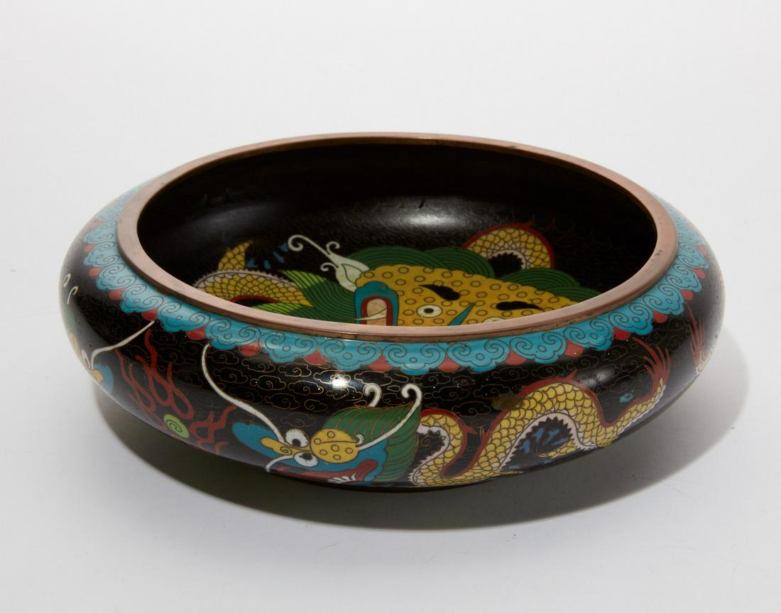A Chinese cloisonne beggars bowl: A Chinese cloisonne beggars bowl with dragon decoration Bearing a Ming Dynasty mark. height 3in (7.5cm); diameter 8in (20cm) Provenance: Property from a Private Palo Alto, California Collection.
