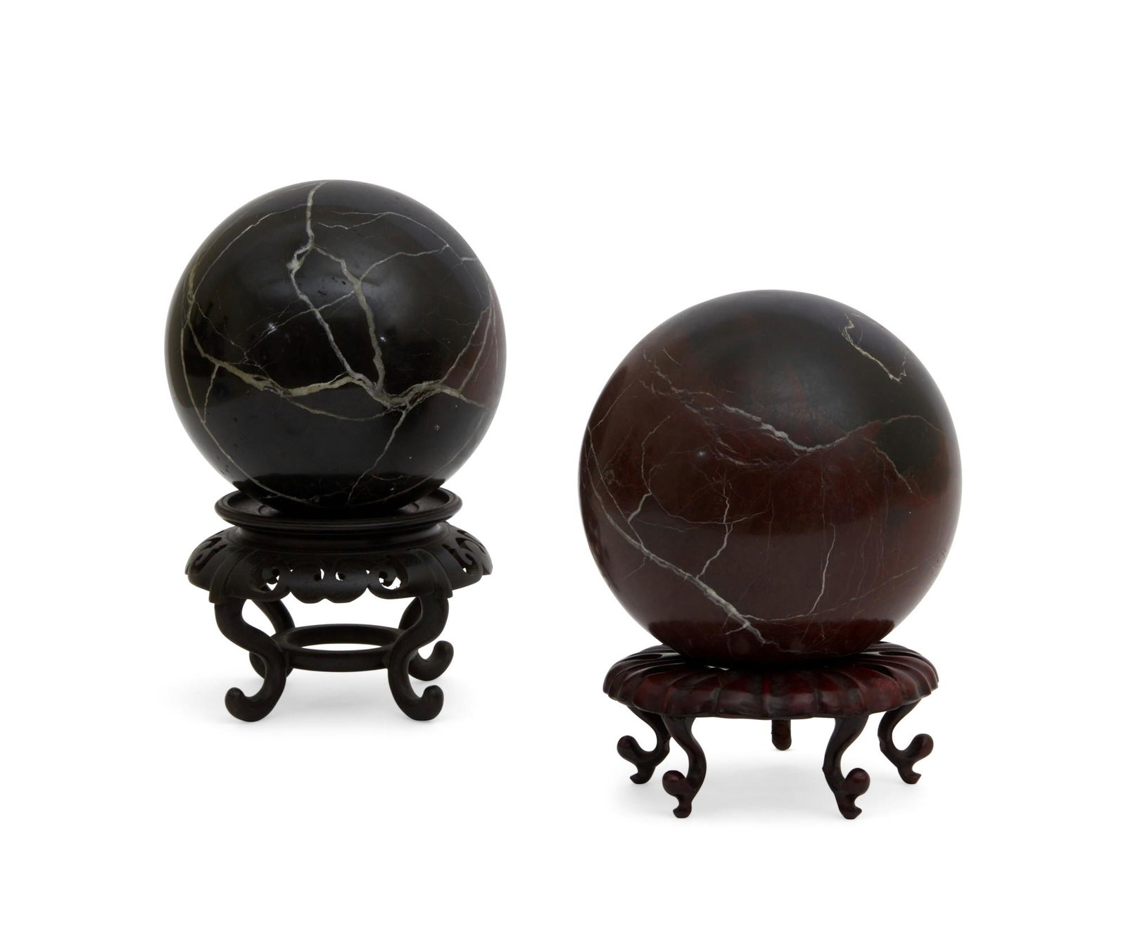 A pair of variegated marble spheres on stands (1 of 10)