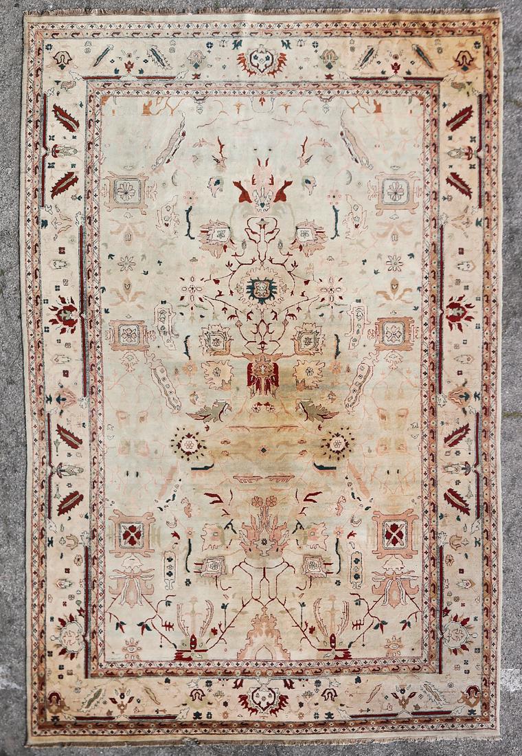A Persian style room size carpet (1 of 2)