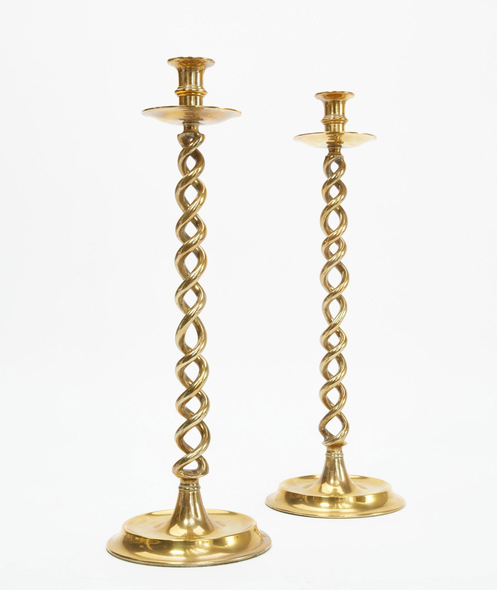 A pair of English brass turned candlesticks (1 of 3)