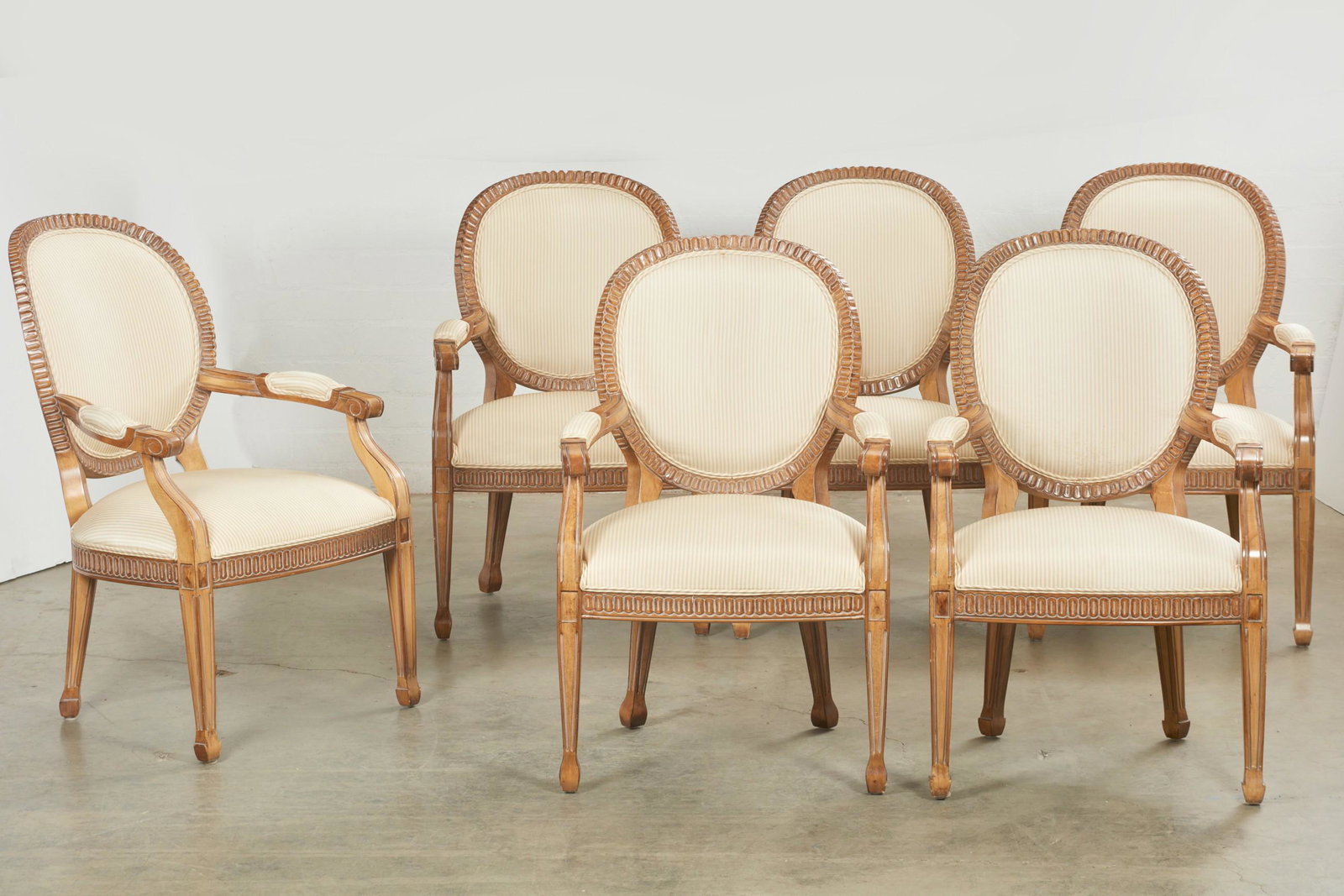 A set of six Kreiss Peninsula armchairs: A set of six Kreiss stained beechwood Peninsula armchairs modern height 40in (102cm); width 25 1/2in (65cm); depth 21in (53cm) Provenance: Property from the Estate of Frank J. Caufield, San Francisco 