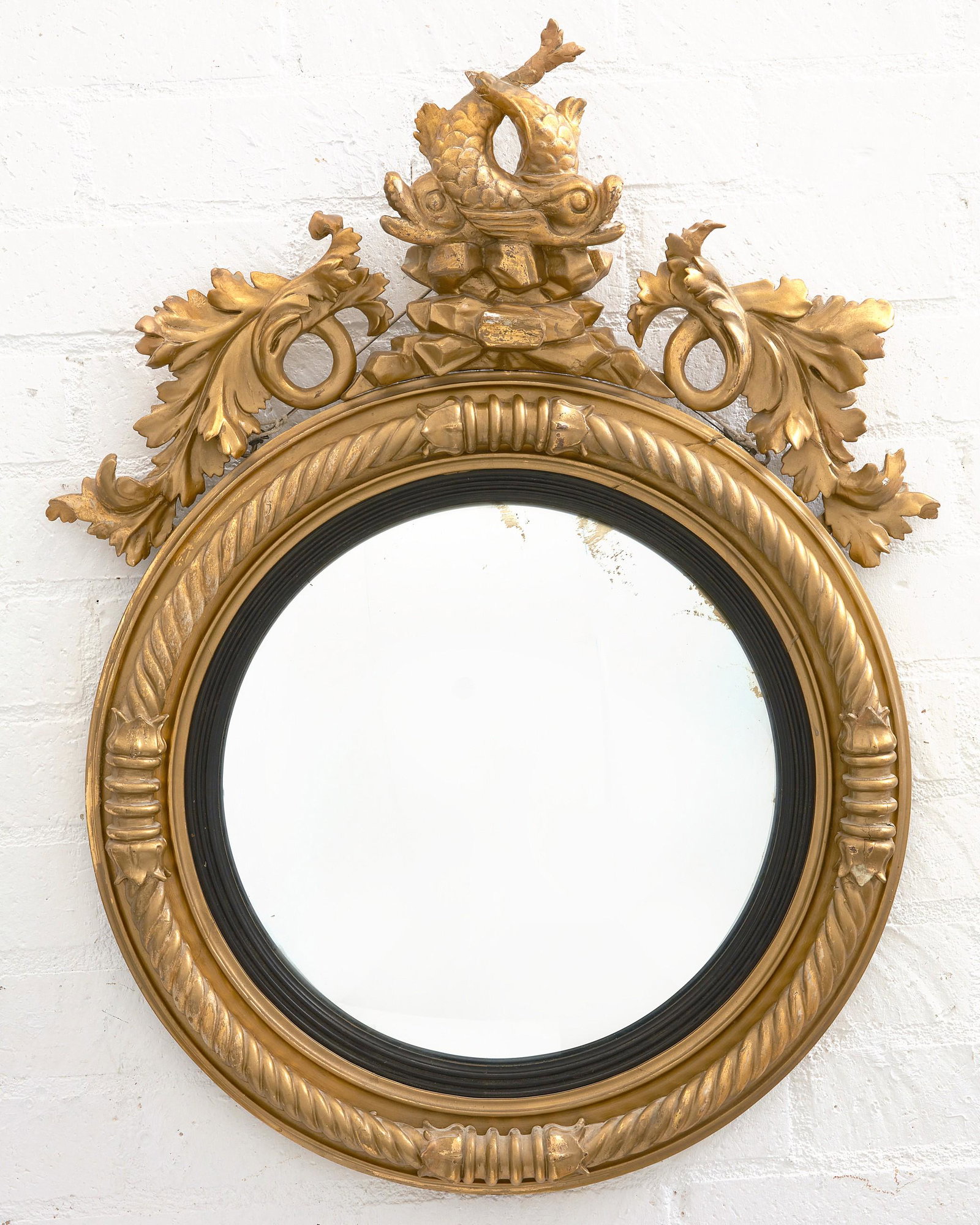 A Regency style giltwood convex mirror (1 of 2)