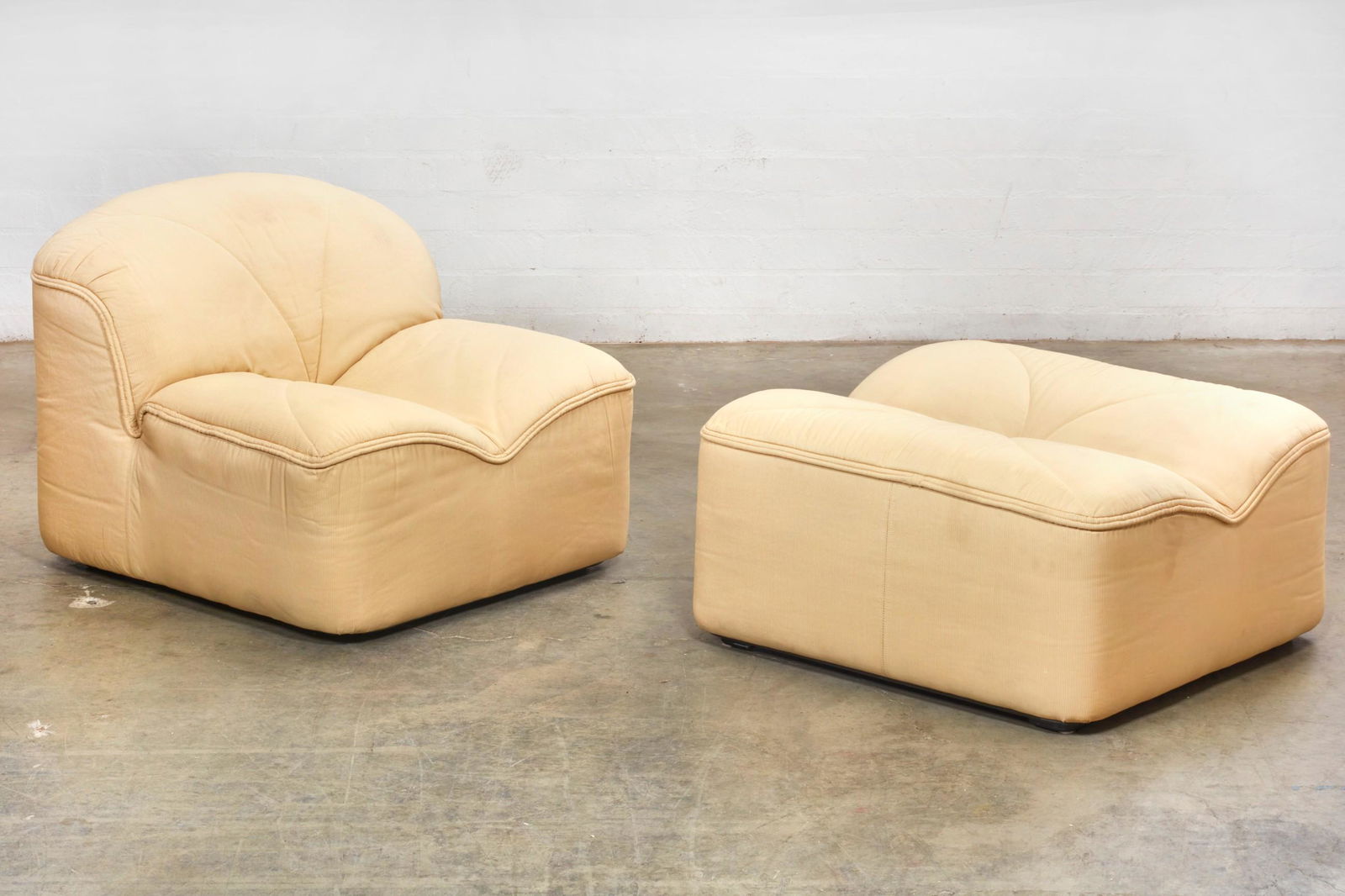 A Faleschini for Pace Emmetre chair and ottoman: A Guido Faleschini for Pace Collection Emmetre lounge chair and ottomanmodernMaker's label to underside. (2)the chair height 27 1/2in (70cm); width 33in (84cm); depth of seat 19in (48cm); ottoman heig