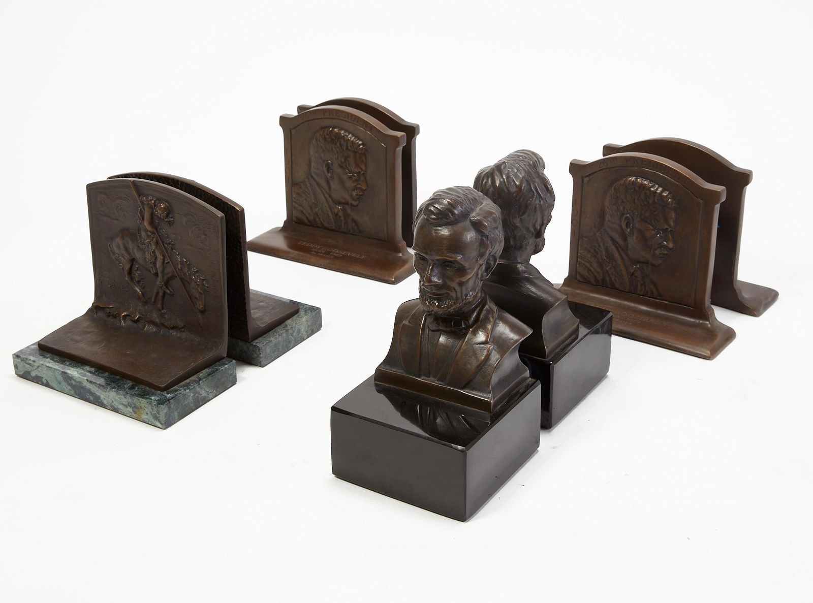 Four pairs of bronze bookends (1 of 6)
