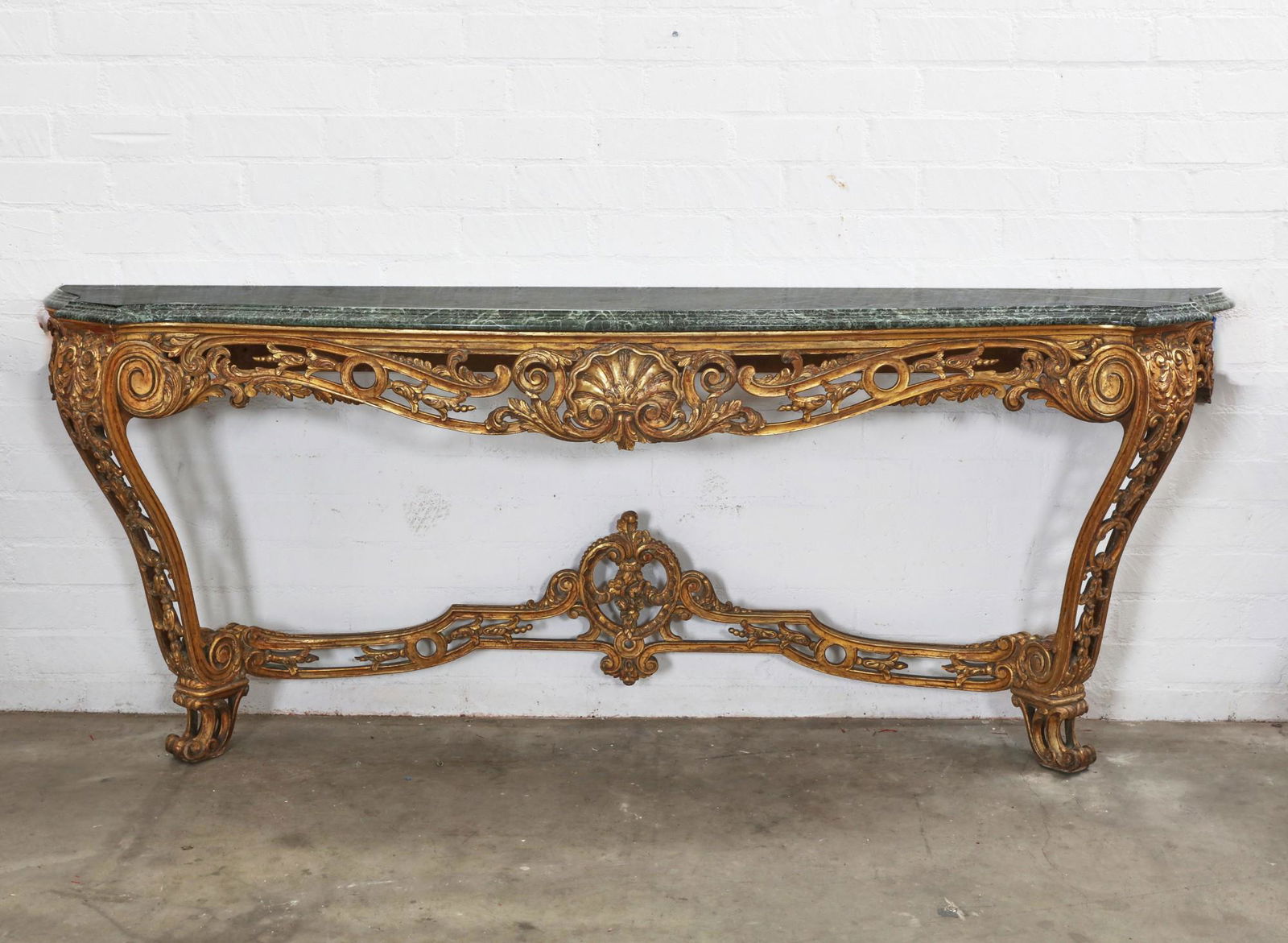 A Continental Baroque style giltwood console (1 of 5)