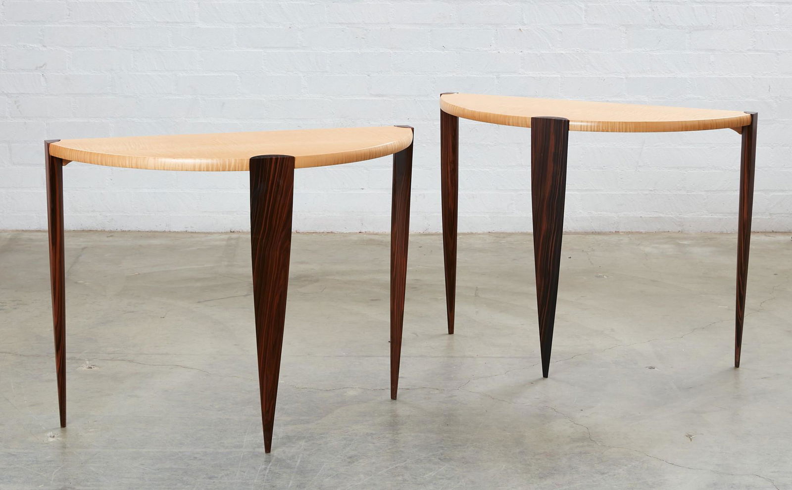 A pair of Modernist demilune console tables (1 of 5)