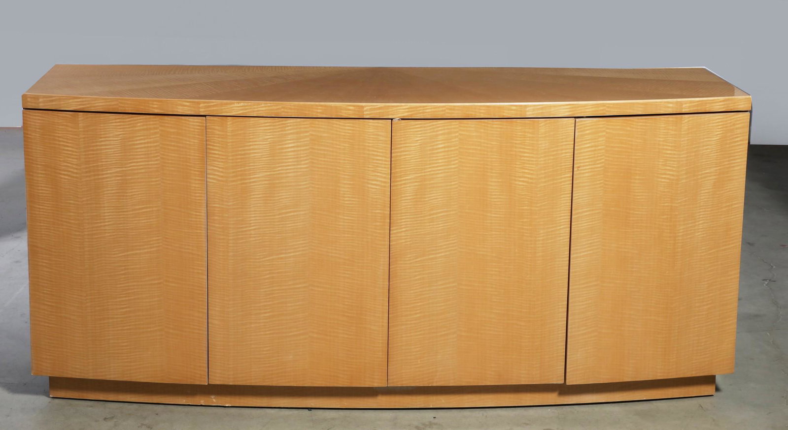 A Modernist blonde wood sideboard: A Modernist blonde wood sideboard contemporary height 32in (81cm); width 60in (153cm); depth 20in (51cm) Provenance: Property from the Estate of Shirley Baskin.
