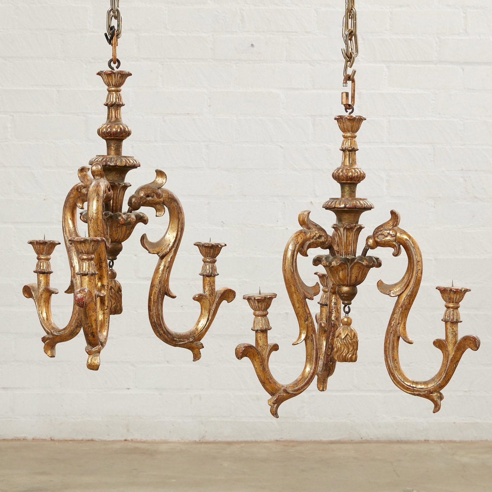 A pair of Baroque style giltwood chandeliers: A pair of Continental Baroque style giltwood chandeliers 19th century height 25in (63.5cm); diameter 19in (48cm)