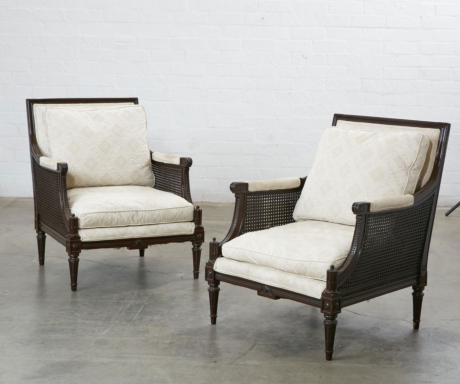 A pair of Neoclassical style cane panel bergeres (1 of 5)
