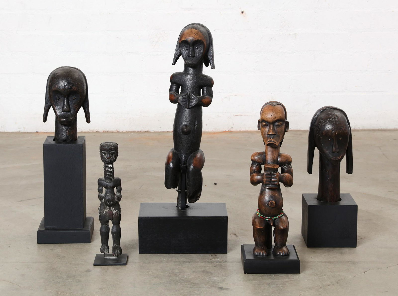 A group of five African wooden tribal figures (1 of 7)