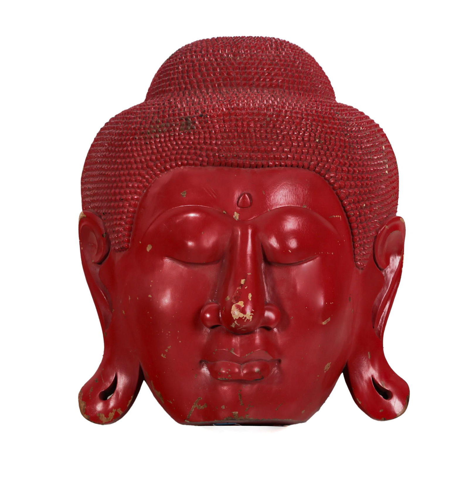 A large red painted decorative Buddha head (1 of 3)