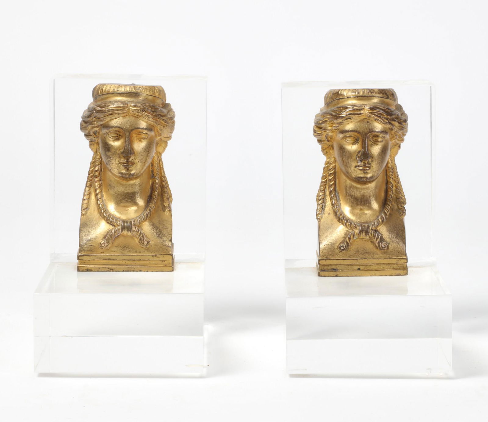 A pair of gilt bronze and lucite bookends (1 of 3)