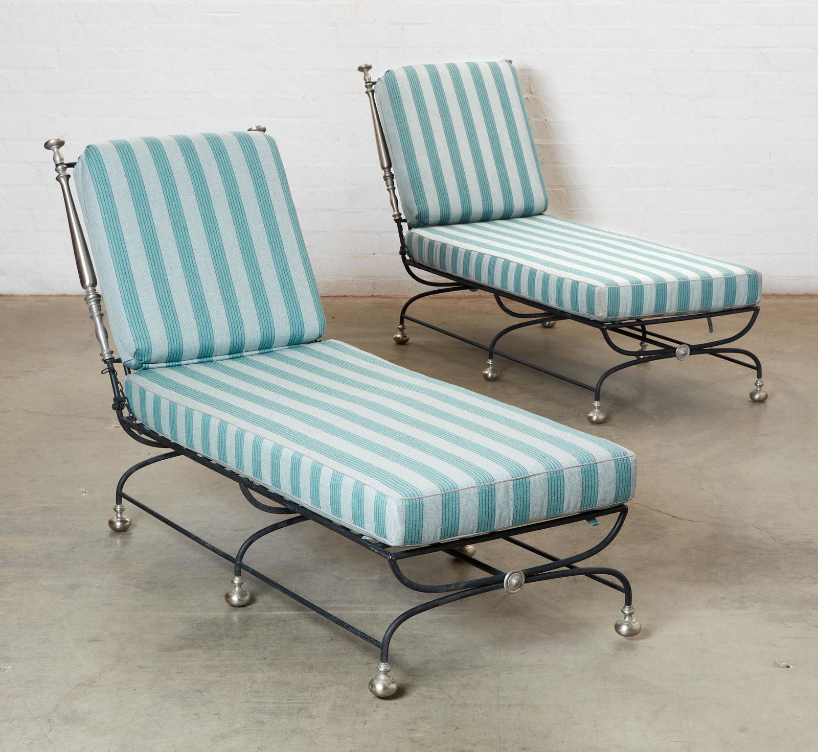 A pair of Formations metal Estate chaises longue: A pair of Formations ebonized metal Estate chaises longuemodernheight 41in (104cm); width 29 1/2in (75cm); depth 86in (218.5cm)