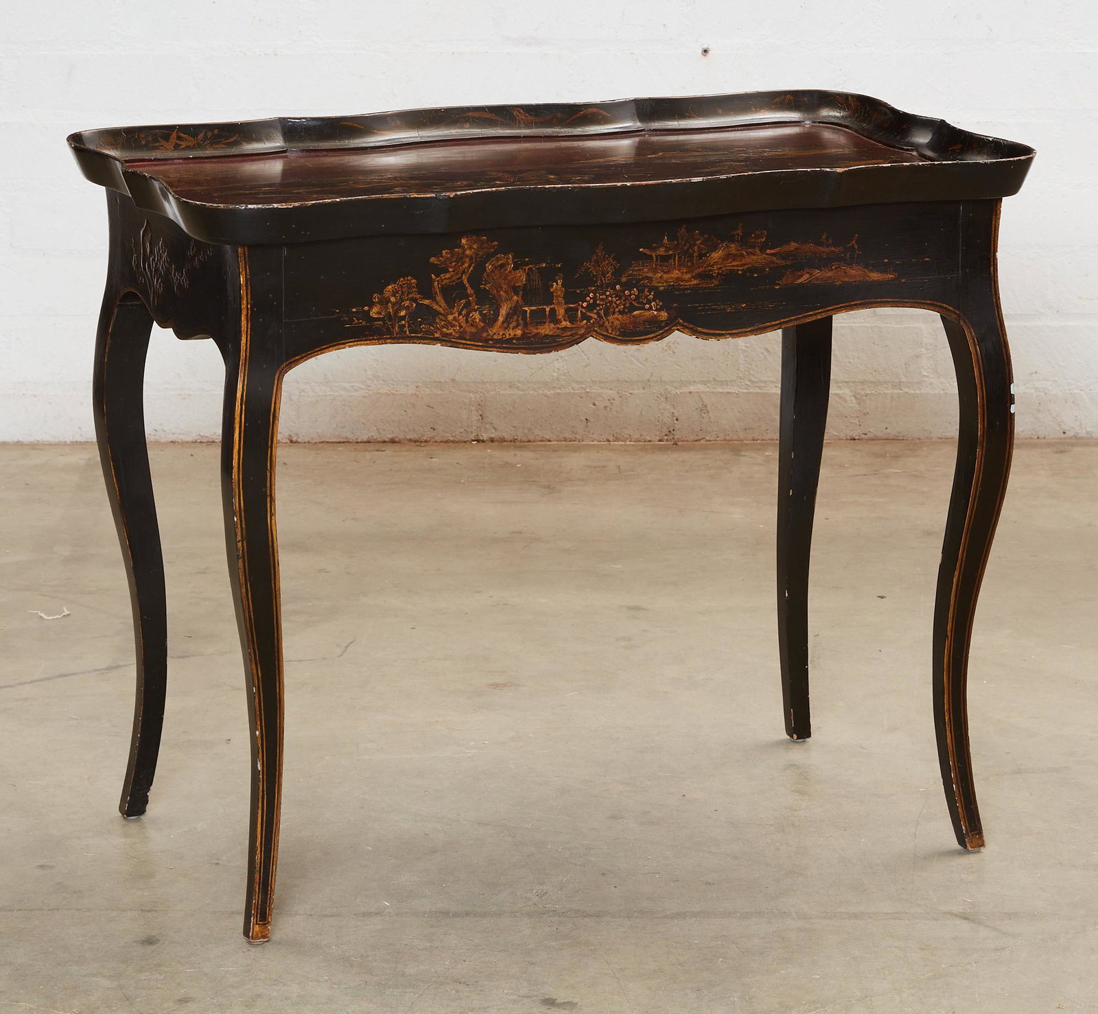 A Michael Taylor Chinoiserie tea table: A Michael Taylor Louis XV style Chinoiserie decorated tea table20th centuryLabel to underside.height 29in (73cm); width 35 1/2in (90cm); depth 23in (58cm)