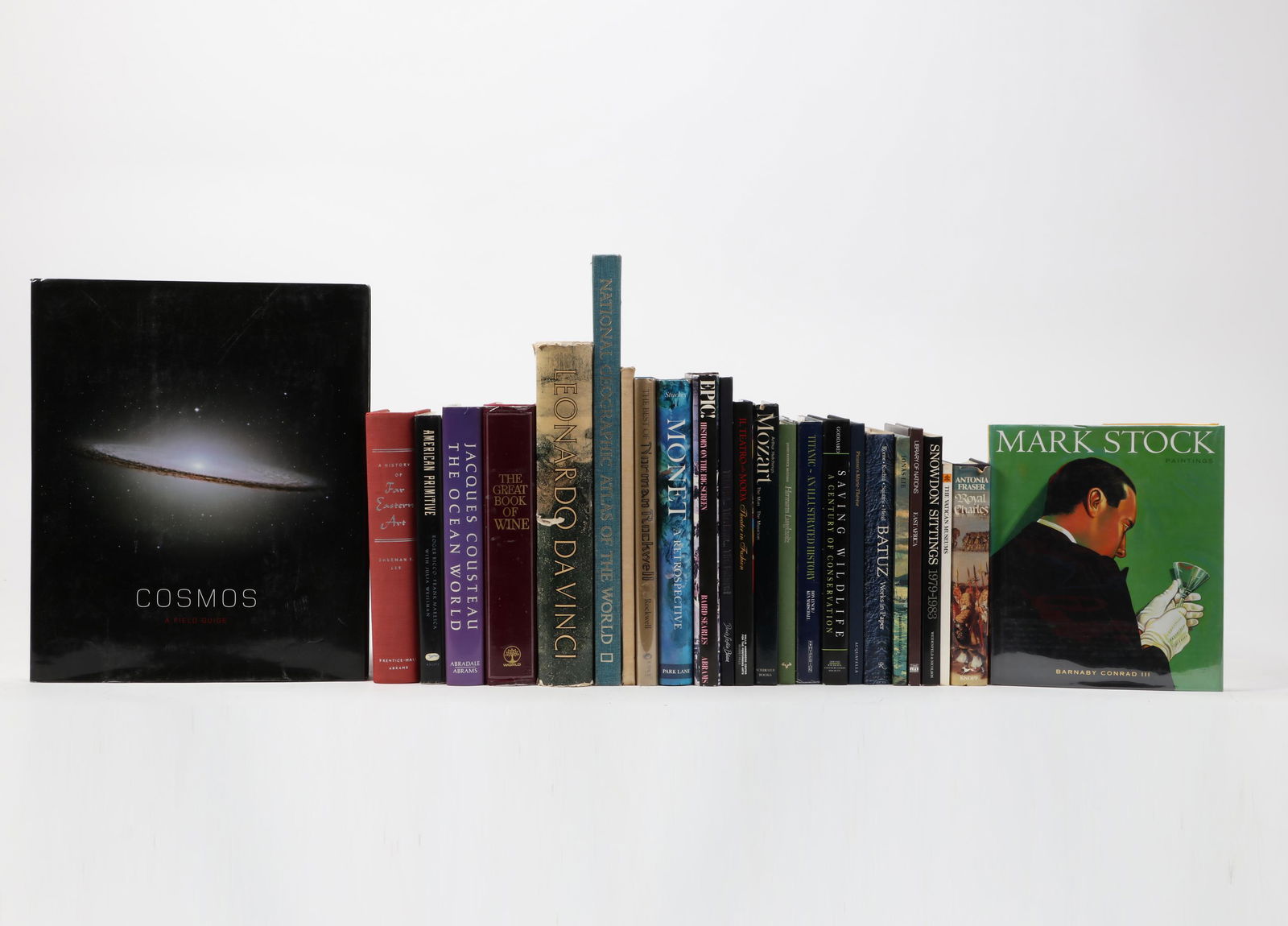 A group of twenty five mixed reference monographs: A group of twenty five mixed reference monographslot includes: Mark Stock: Paintings. Barnaby Conrad III. NY: Metropolitan Books, 2000. 2. American Primitive: Discoveries in Folk Sculpture. Roger Ricc