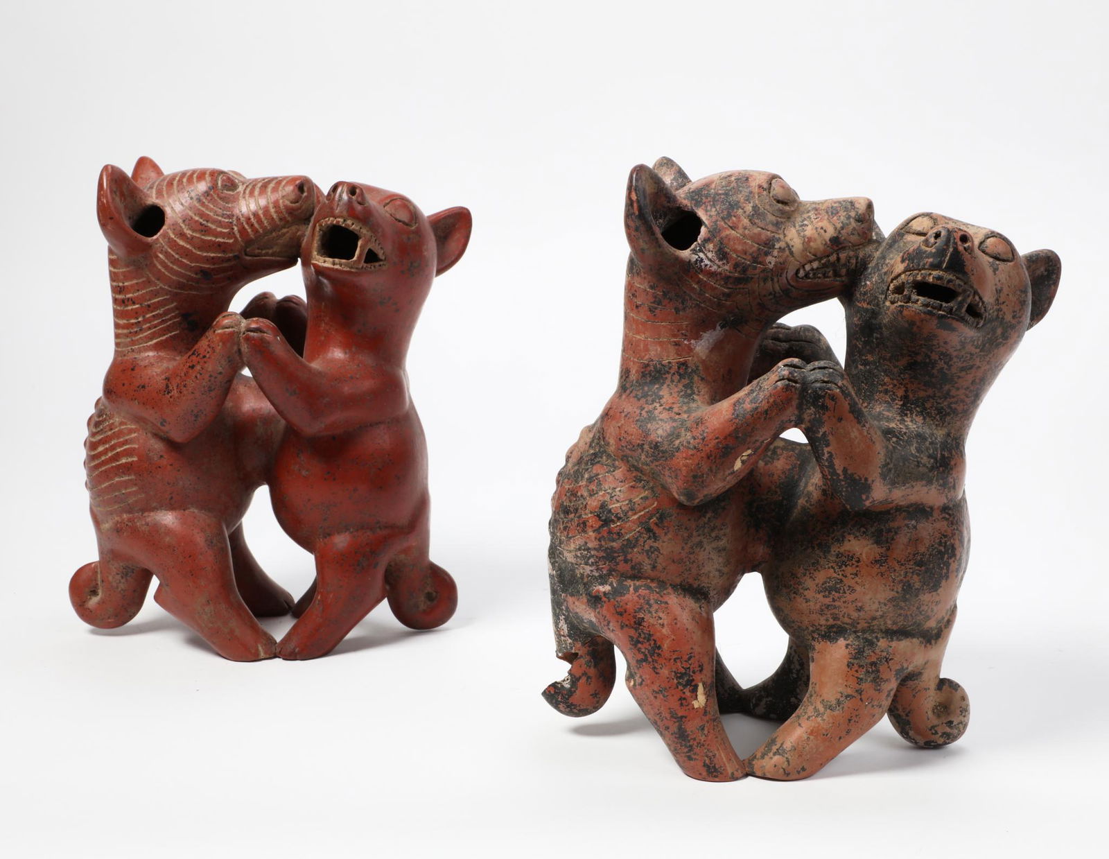 Two South American pottery groups of dancing dogs (1 of 3)