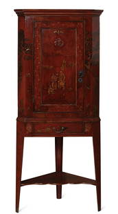 A George III scarlet japanned corner cabinet: A George III scarlet japanned corner cabinet on later stand fourth quarter 18th century height 71 3/4in (182.5cm); width 29 1/2in (75cm); depth 17in (43cm) Provenance: Sold Bonhams, San Francisco,