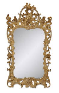 George II carved giltwood mirror, possibly Irish: A George II carved giltwood mirror possibly Irish mid 18th century height 54in (137cm); width 28 1/2in (72.5cm); depth 6in (15cm) Provenance: Sold Bonhams, Los Angeles, The Collection of Sir Daniel