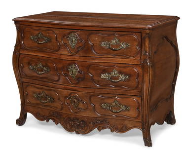 A Louis XV Provincial walnut commode: A Louis XV Provincial walnut commodesecond half 18th centuryheight 33 3/4in (86cm); width 45in (144cm); depth 25 3/4in (65.5cm) Provenance:With Antonio's Antiques, San Francisco, California.