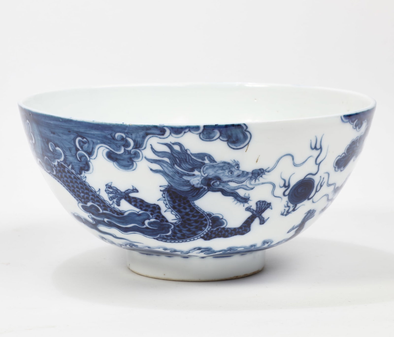 A Vietnamese blue and white dragon porcelain bowl: A Vietnamese blue and white dragon porcelain bowl With character mark to underside. height 3 1/2in (9cm); diameter 7 1/2in (19cm)