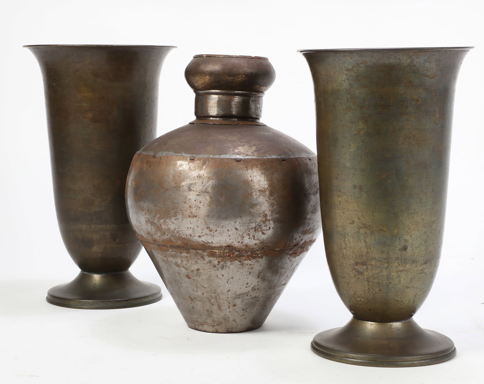 A group of three metalware urns: A group of three metalware urns19th-20th centuryheight of pair 13 1/2in (34.5cm); diameter 8 1/4in (21cm) Provenance:Property from a Private Collection, Beverly Hills, CA.
